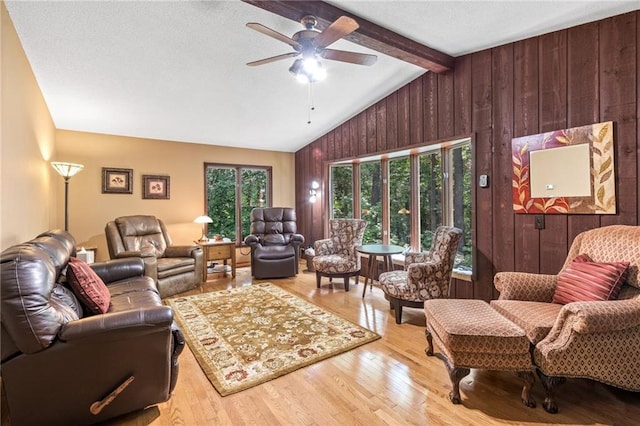 115 Pine Crest Rd, Balsam Lake, WI 54810 - living area with vaulted ceiling with beams, wood walls, light wood finished floors, and a wealth of natural light