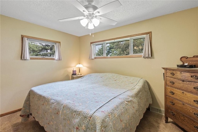 115 Pine Crest Rd, Balsam Lake, WI 54810 - carpeted bedroom featuring a ceiling fan, a textured ceiling, and baseboards