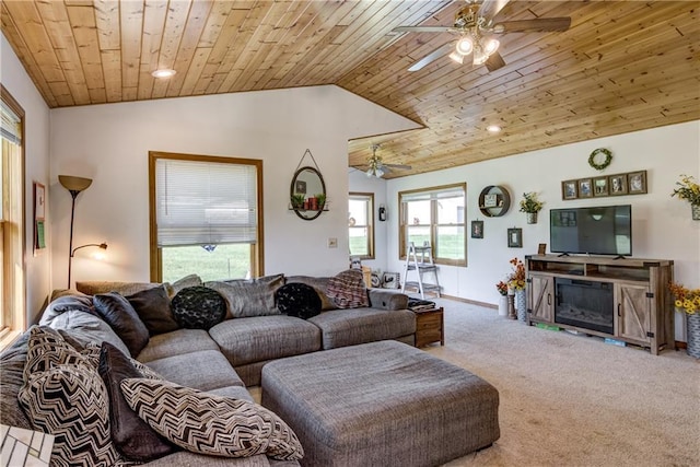 carpeted living area with wooden ceiling, ceiling fan, a fireplace, and vaulted ceiling