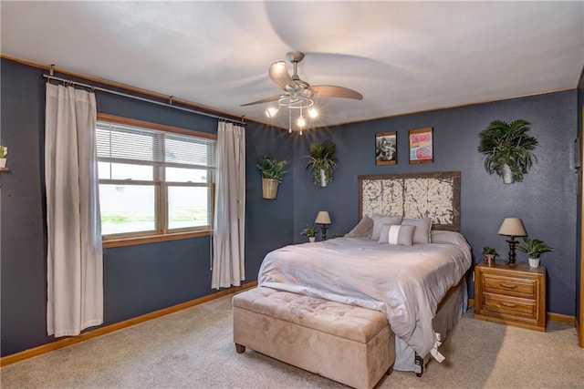 bedroom with carpet flooring, ceiling fan, and baseboards