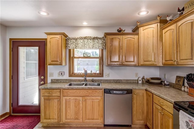 kitchen with stainless steel dishwasher, range with electric stovetop, a sink, and recessed lighting