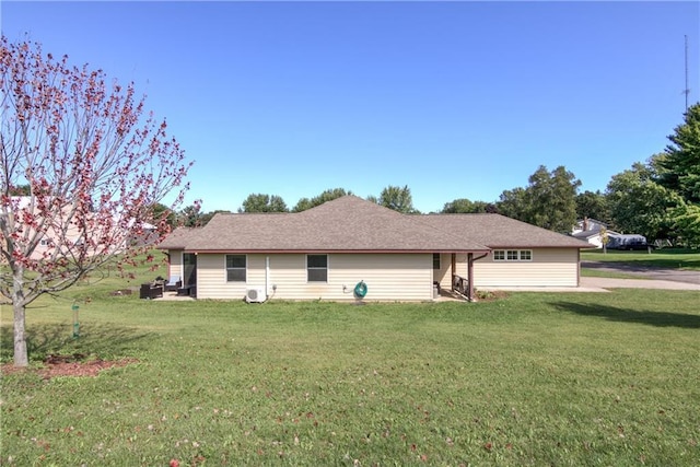 view of side of property with a lawn