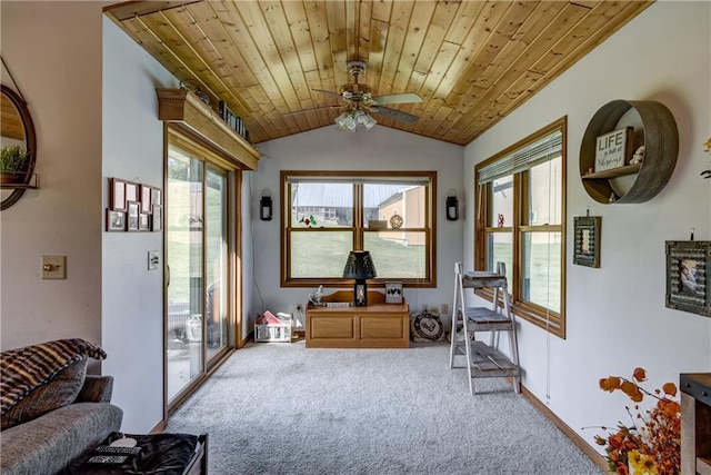 interior space with carpet floors, a ceiling fan, wood ceiling, vaulted ceiling, and baseboards