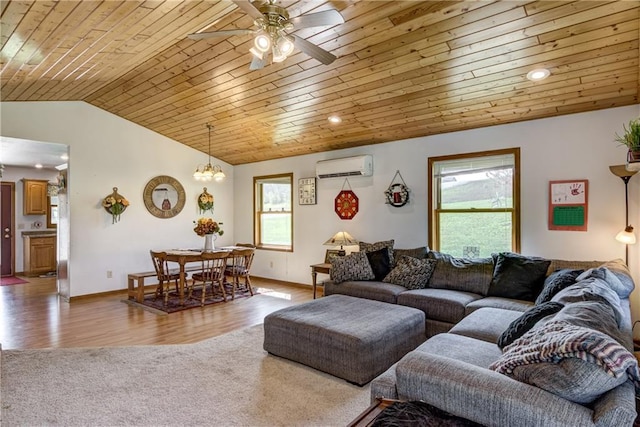 living area with lofted ceiling, an AC wall unit, wooden ceiling, and a healthy amount of sunlight