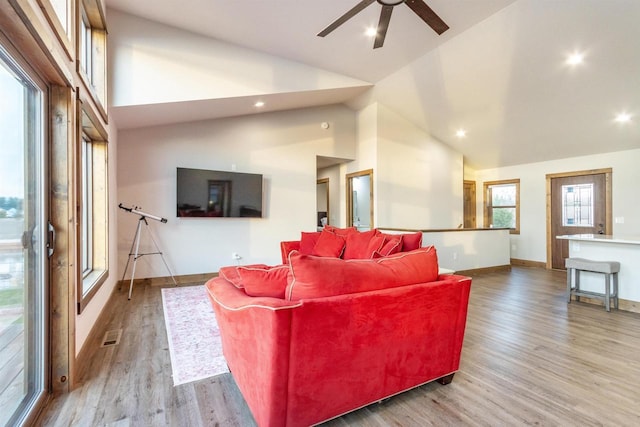 N8791 Lake Cabin Dr, New Lisbon, WI 53950 - living room featuring high vaulted ceiling, wood finished floors, and baseboards