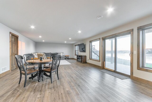 N8791 Lake Cabin Dr, New Lisbon, WI 53950 - dining area with light wood-style flooring, plenty of natural light, visible vents, and recessed lighting