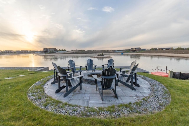 N8791 Lake Cabin Dr, New Lisbon, WI 53950 - view of patio with a fire pit and a water view