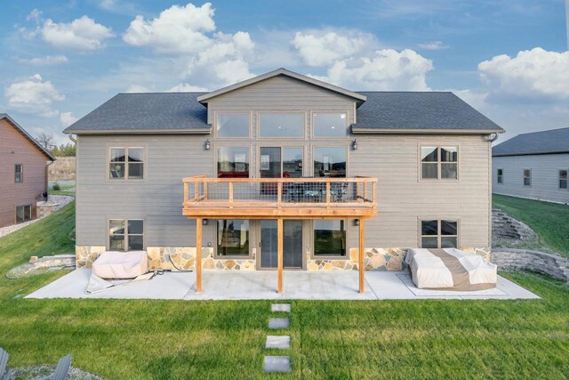 N8791 Lake Cabin Dr, New Lisbon, WI 53950 - rear view of house featuring a shingled roof, a patio, and a yard