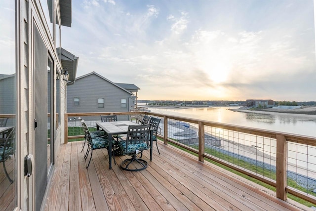 N8791 Lake Cabin Dr, New Lisbon, WI 53950 - wooden terrace with a water view and outdoor dining space