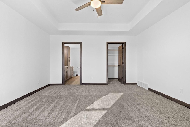 3752 Westpoint Rd, Suamico, WI 54313 - unfurnished bedroom featuring carpet, a raised ceiling, visible vents, and baseboards