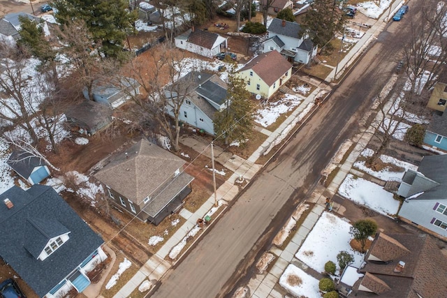 snowy aerial view featuring a residential view