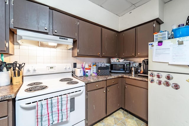 kitchen with dark brown cabinets, white appliances, decorative backsplash, and under cabinet range hood