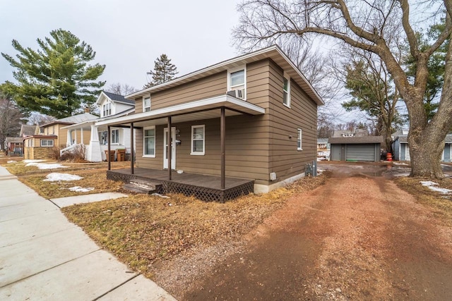 view of front of property featuring a porch and driveway