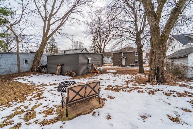 snowy yard with an outdoor structure