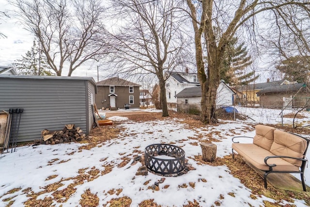 yard covered in snow featuring an outdoor living space