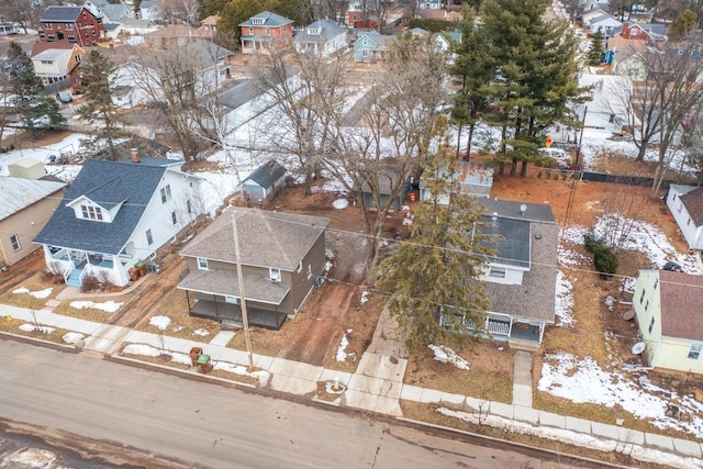 snowy aerial view featuring a residential view