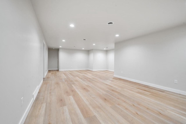 unfurnished room featuring recessed lighting, baseboards, visible vents, and light wood finished floors