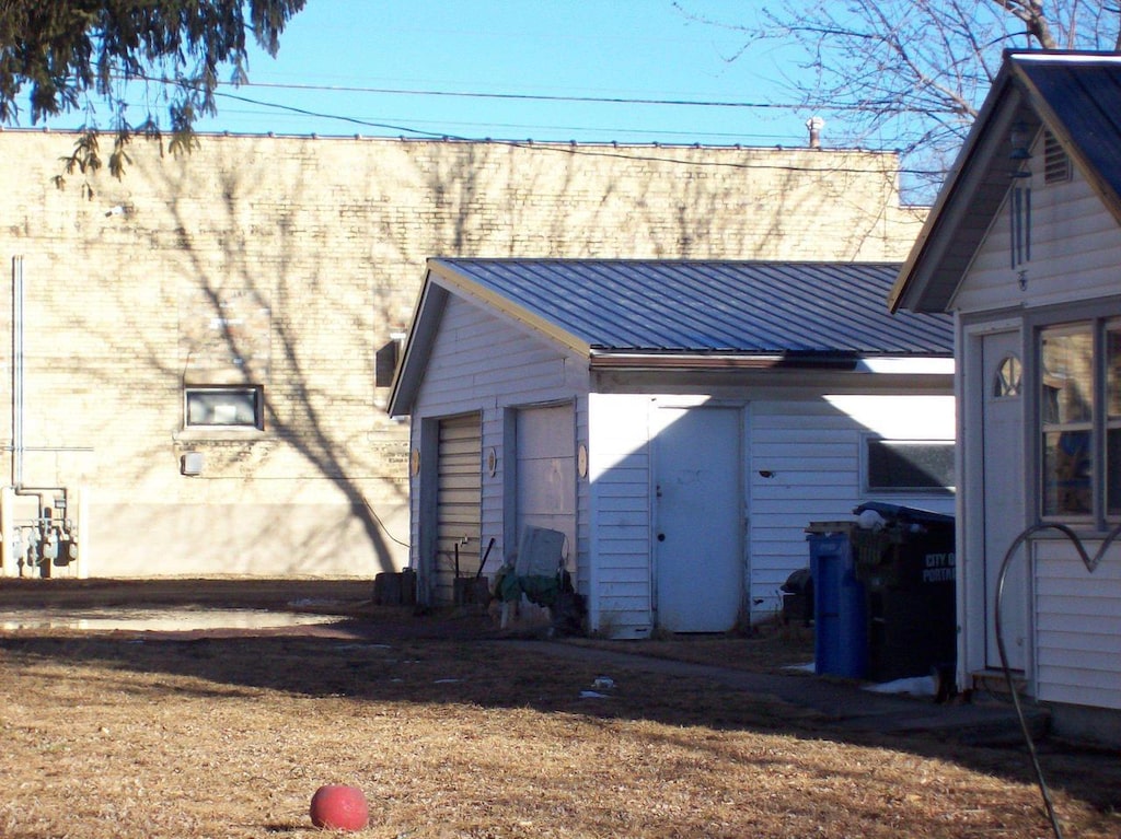 back of property with metal roof