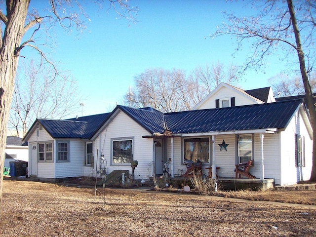 view of front of house featuring a porch and metal roof