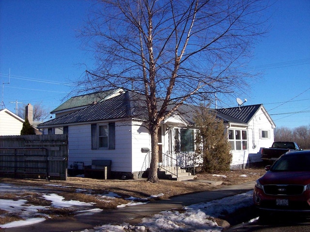 1002 Adams St, Portage, WI 53901 - view of front of property featuring metal roof and entry steps