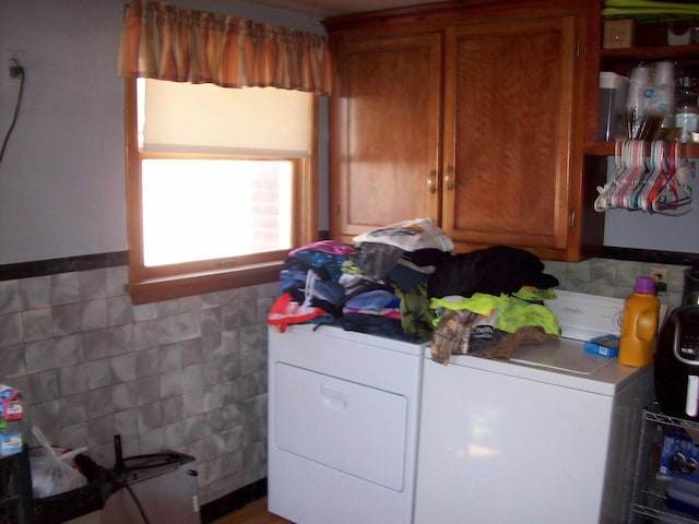 1002 Adams St, Portage, WI 53901 - laundry area featuring washer and clothes dryer and cabinet space