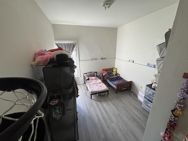 bedroom with wood finished floors