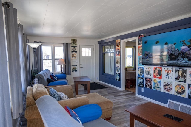 living room with wood finished floors and baseboards