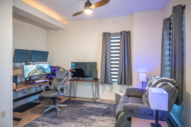 home office with ceiling fan, wood finished floors, and baseboards