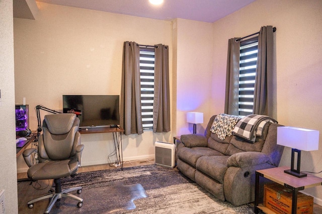 office space featuring baseboards, a wealth of natural light, and wood finished floors