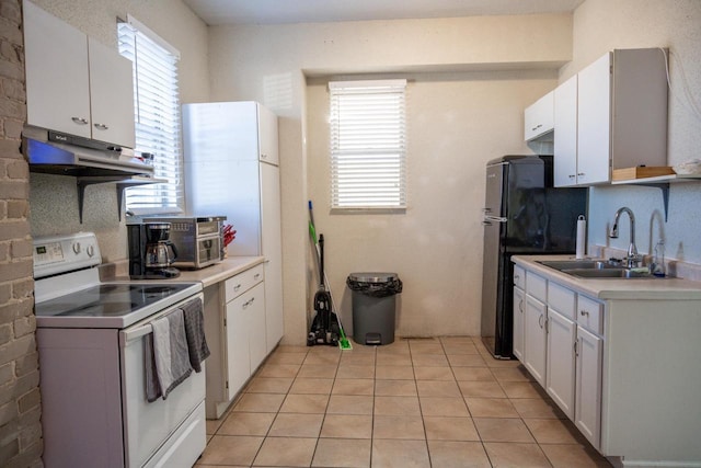 kitchen with a sink, under cabinet range hood, white cabinets, and electric stove