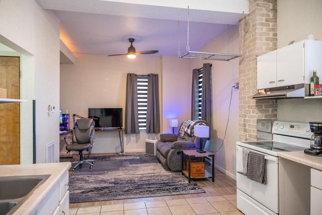 kitchen featuring white electric range oven, light countertops, open floor plan, white cabinetry, and under cabinet range hood