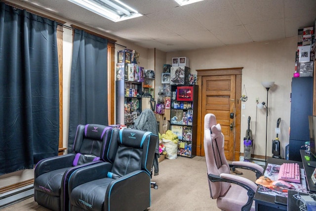 home office featuring carpet floors and a baseboard heating unit