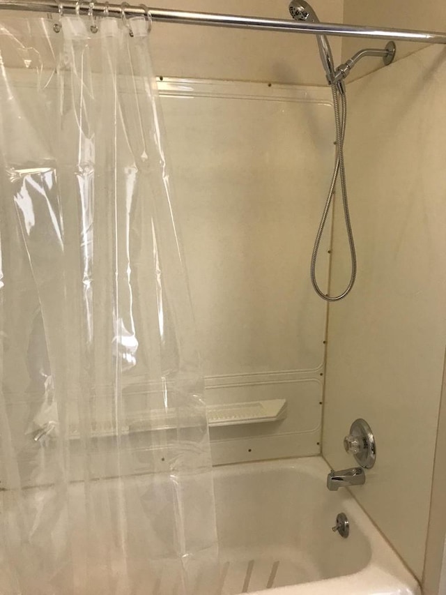 bathroom featuring shower / bath combination with curtain