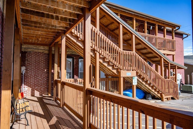 wooden deck featuring stairs