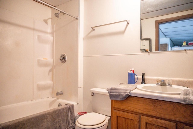 full bath with shower / tub combination, vanity, and toilet