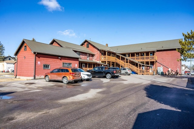 view of property featuring uncovered parking