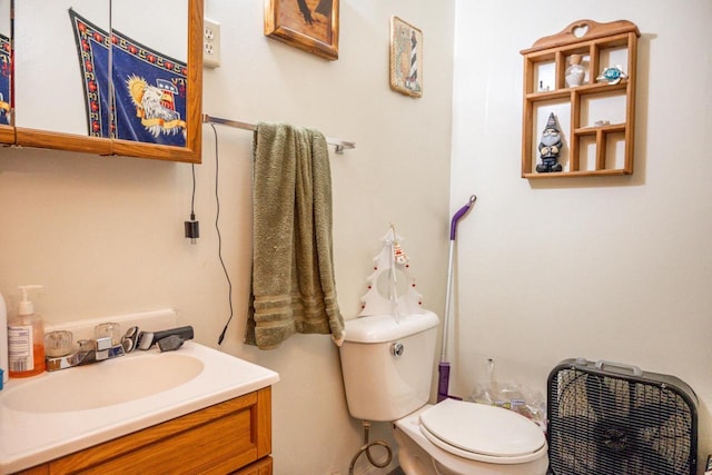 bathroom with toilet and vanity