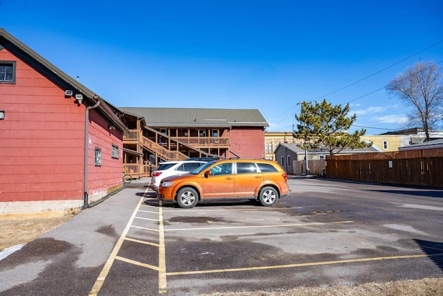 uncovered parking lot with fence