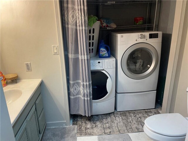 155 Zach St, Glidden, WI 54527 - laundry room with laundry area, washer and clothes dryer, and a sink