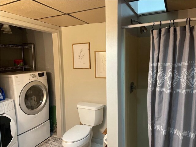 155 Zach St, Glidden, WI 54527 - bathroom with a paneled ceiling, washer / clothes dryer, and a shower with shower curtain