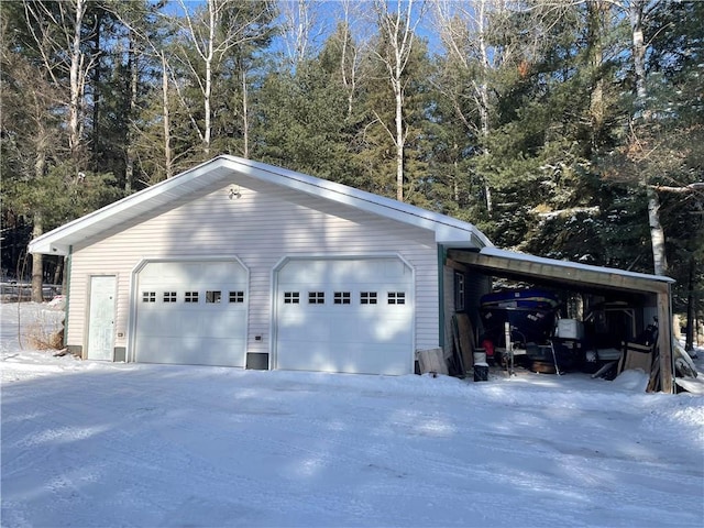 155 Zach St, Glidden, WI 54527 - snow covered garage with a garage