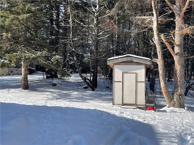 155 Zach St, Glidden, WI 54527 - snowy yard featuring an outbuilding