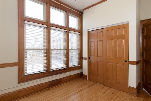 interior space with light wood-type flooring and baseboards