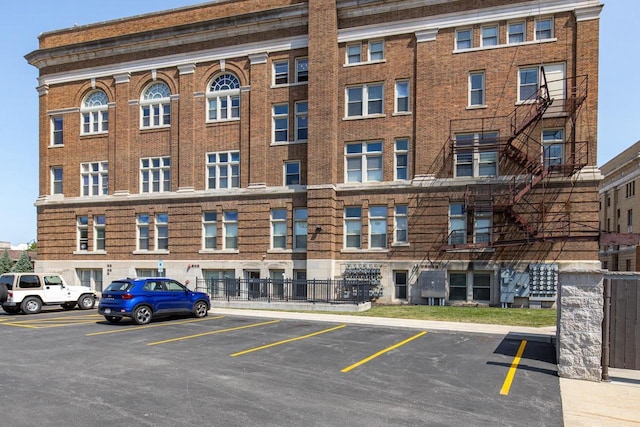 view of property featuring uncovered parking