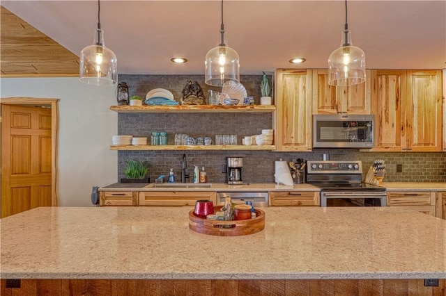 kitchen with appliances with stainless steel finishes, backsplash, a sink, and light stone counters