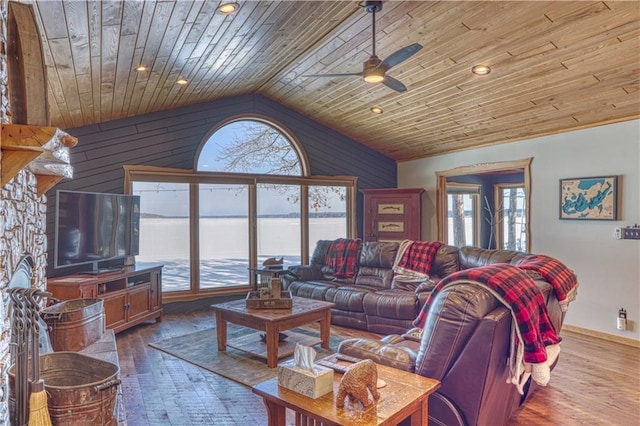 living room with dark wood-style floors, lofted ceiling, and a healthy amount of sunlight