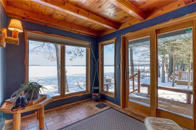 sunroom / solarium with wooden ceiling, a water view, beamed ceiling, and visible vents