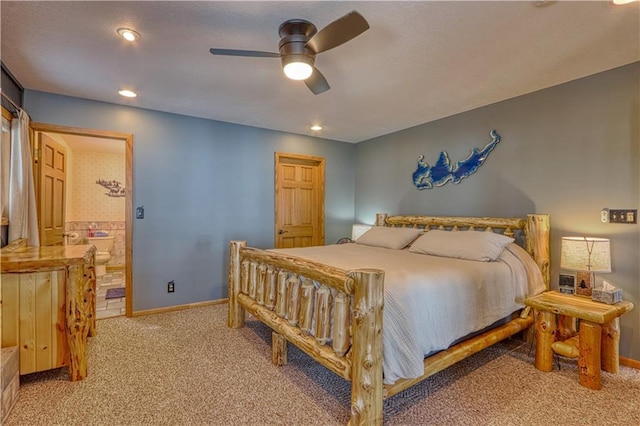 carpeted bedroom featuring ceiling fan, recessed lighting, ensuite bath, and baseboards