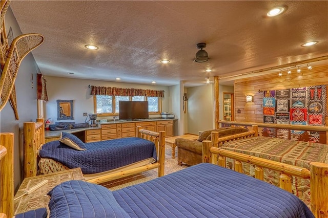 bedroom with recessed lighting and a textured ceiling