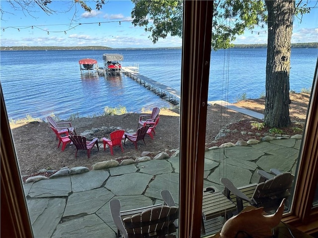 view of water feature with an outdoor fire pit